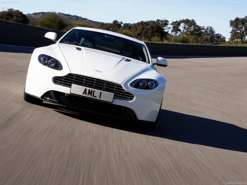 white aston martin on track