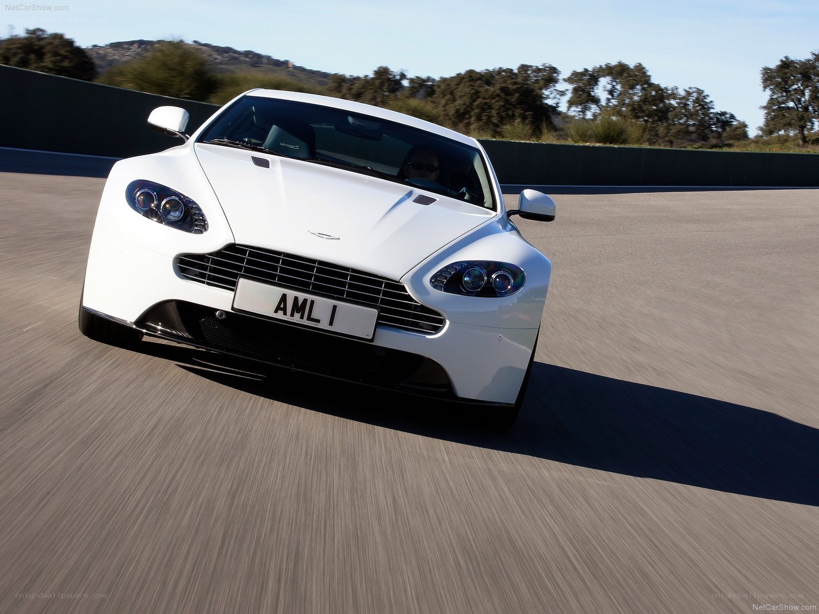 white aston martin on track