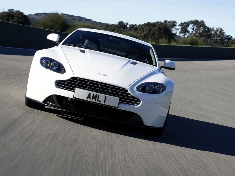 white aston martin on track