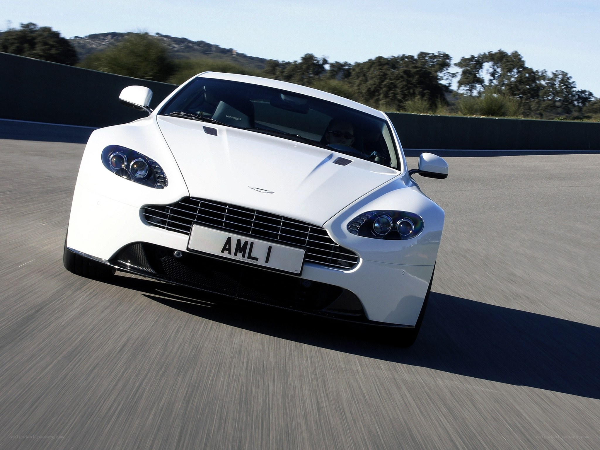 white aston martin on track