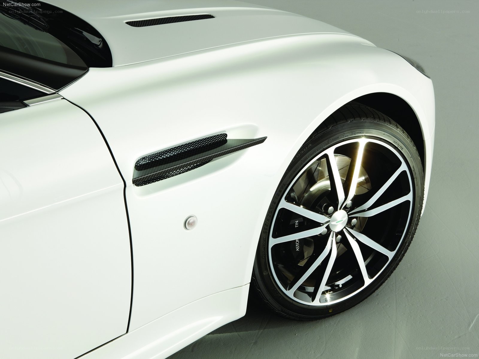 White Aston Martin side view
