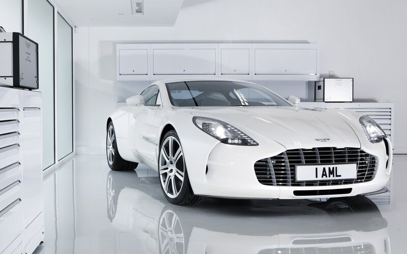 White Aston sports car in garage