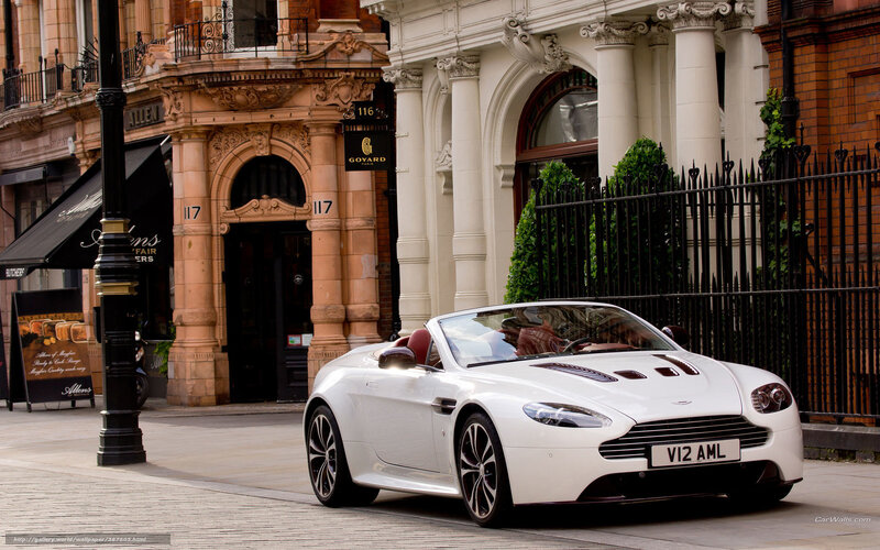 White Aston V12 convertible on street