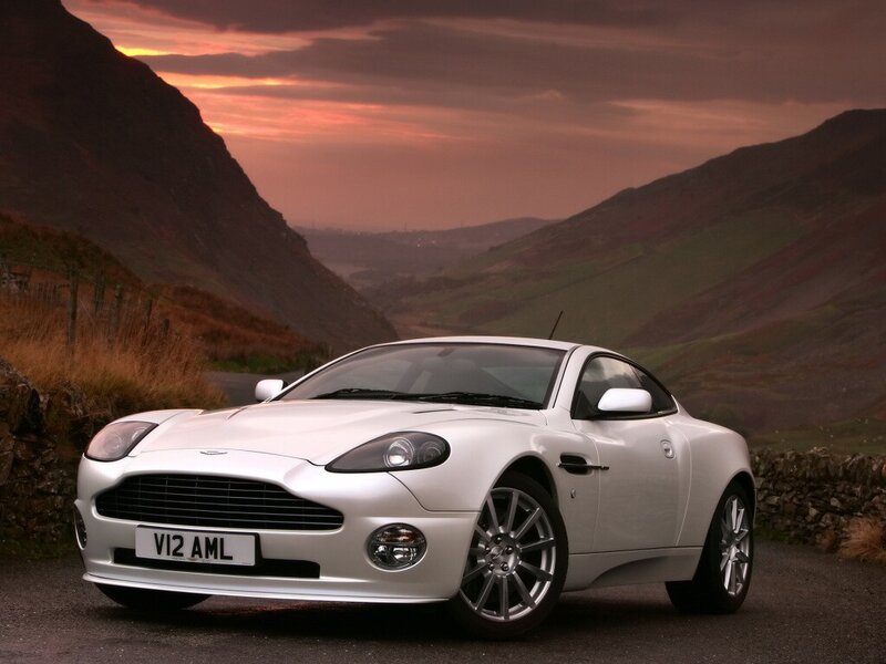 White Aston V12 in a mountain valley