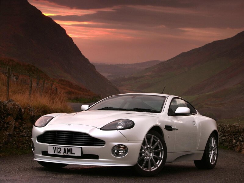 White Aston V12 in a mountain valley