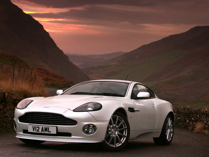 White Aston V12 in mountain valley