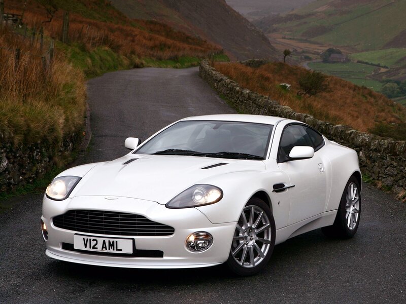 White Aston V12 on a country road