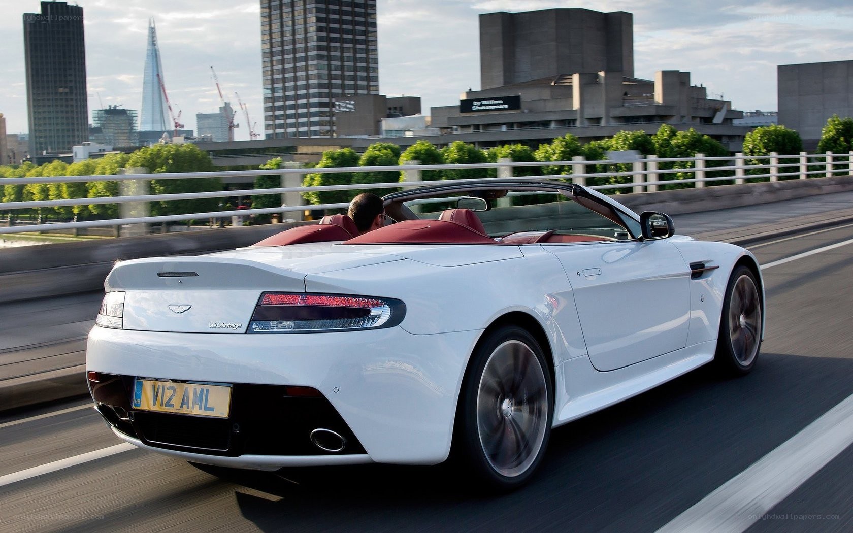 White Aston V12 Vantage driving