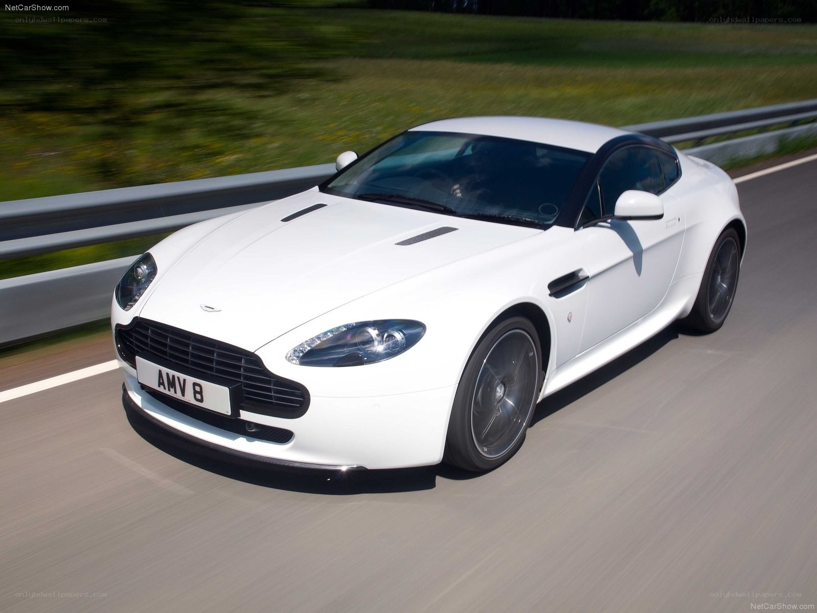 White Aston V8 in motion