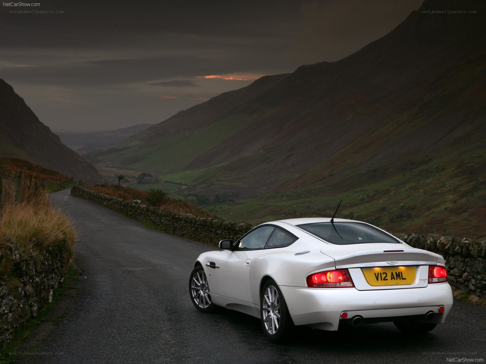 White Aston V8 on a mountain road