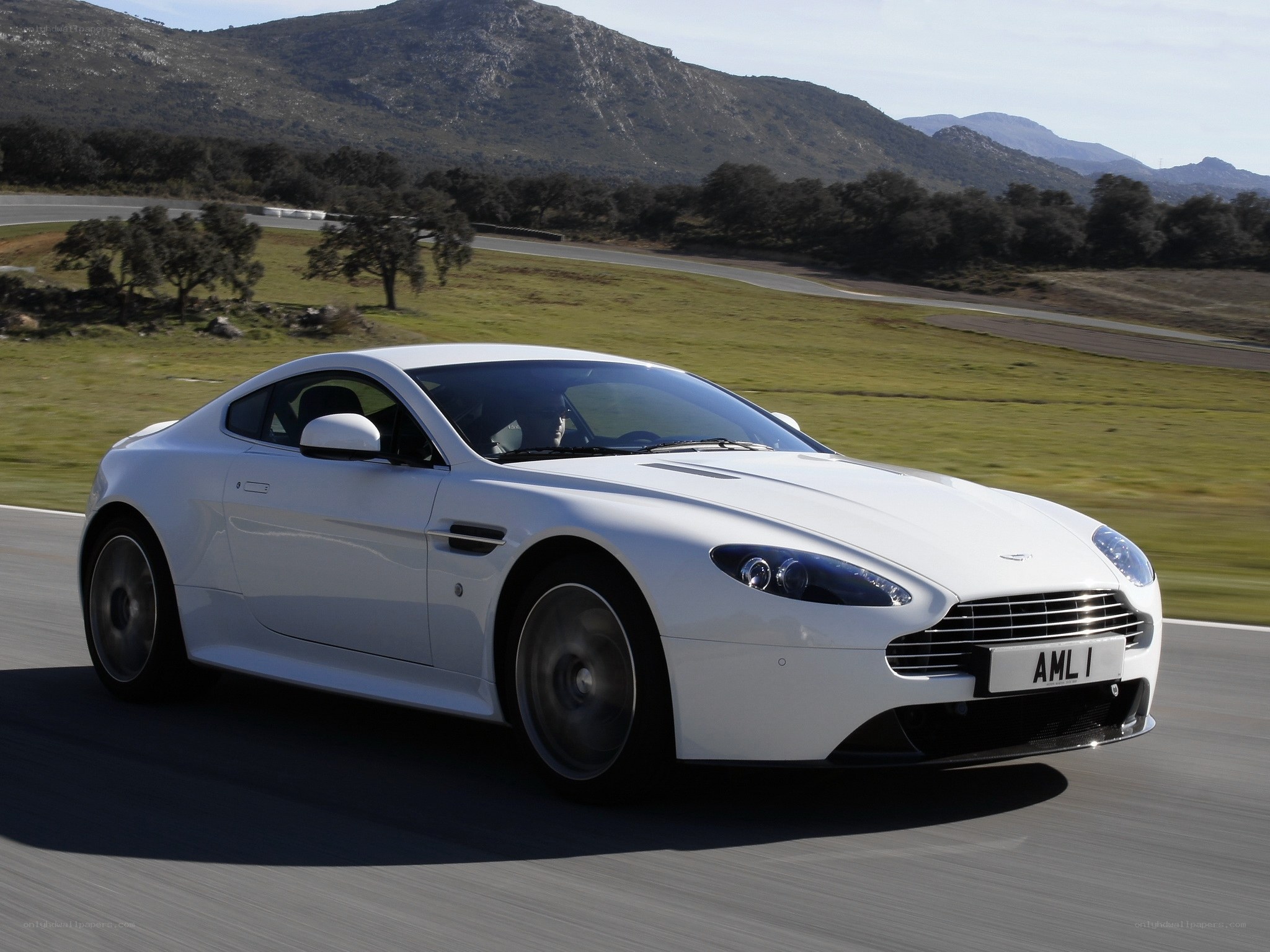 White Aston V8 on a racetrack