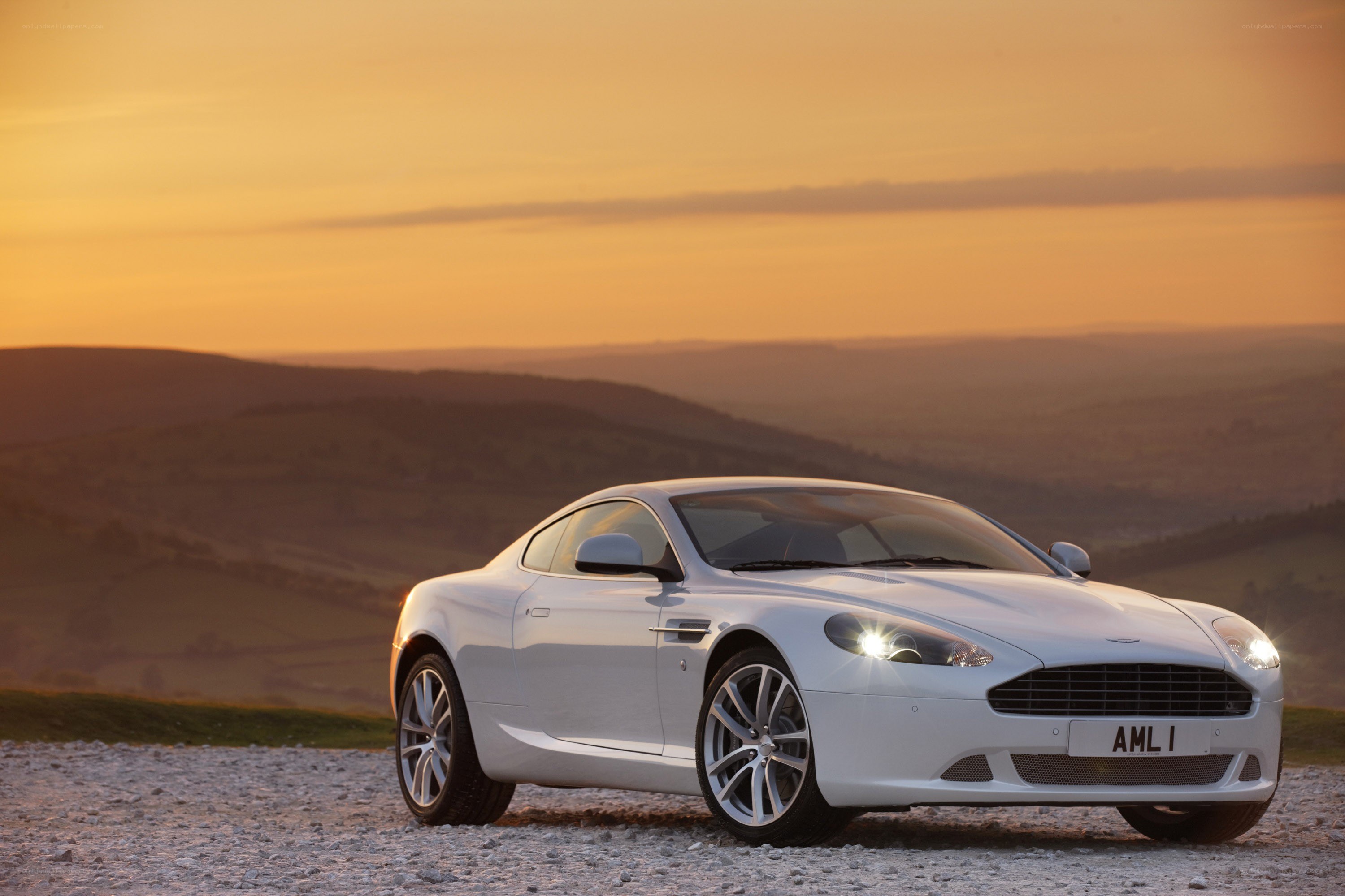 White Aston V8 Vantage at sunset