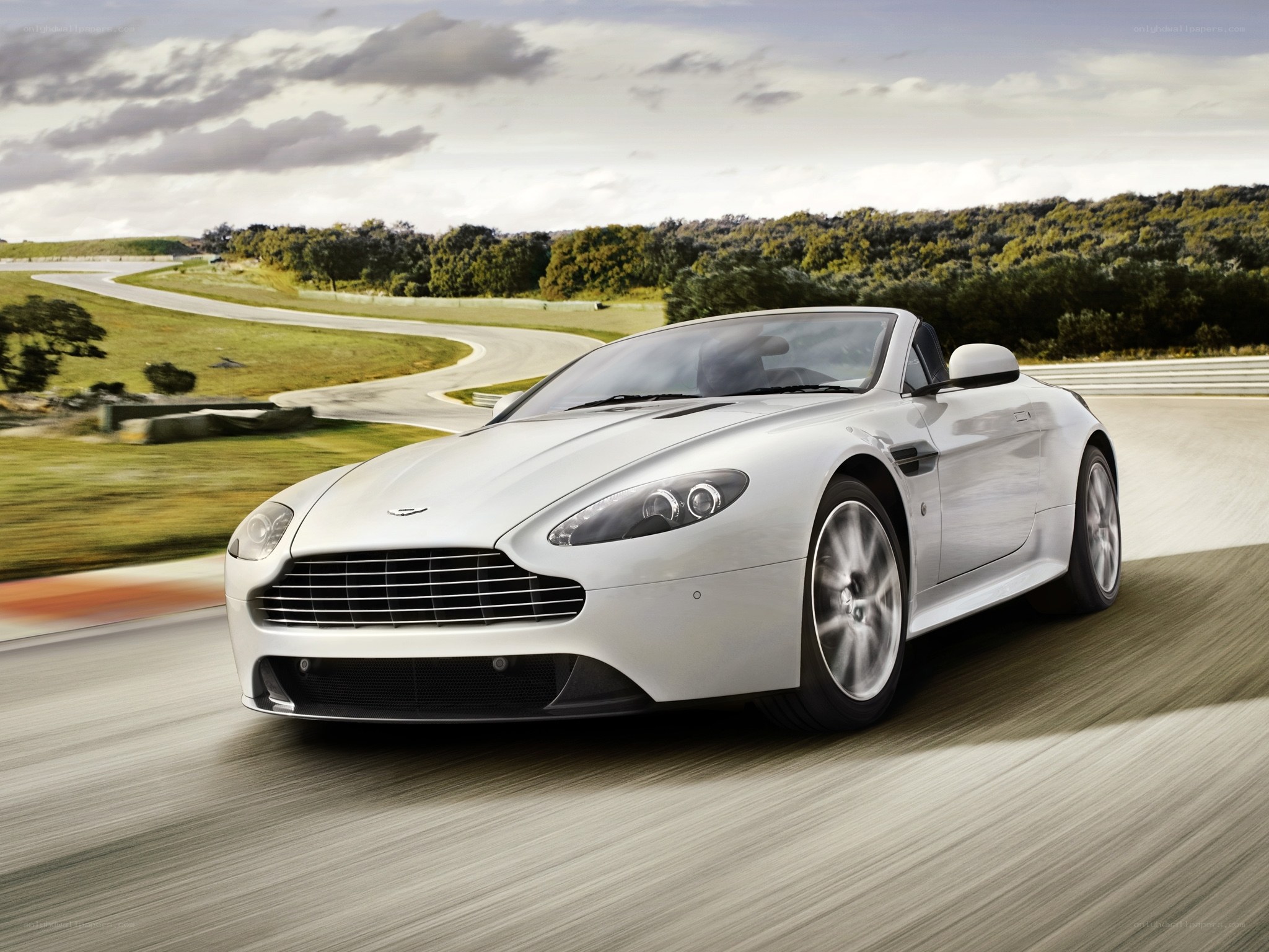 White Aston V8 Vantage on a racetrack
