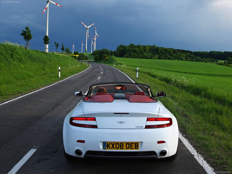 White Aston Vantage convertible on country road