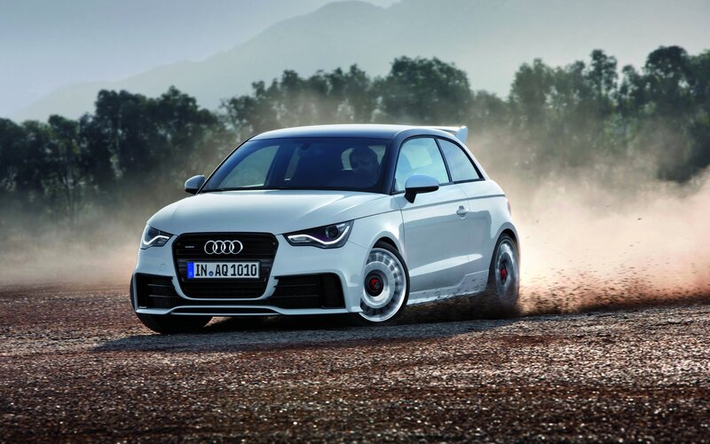 White Audi A1 driving on dirt