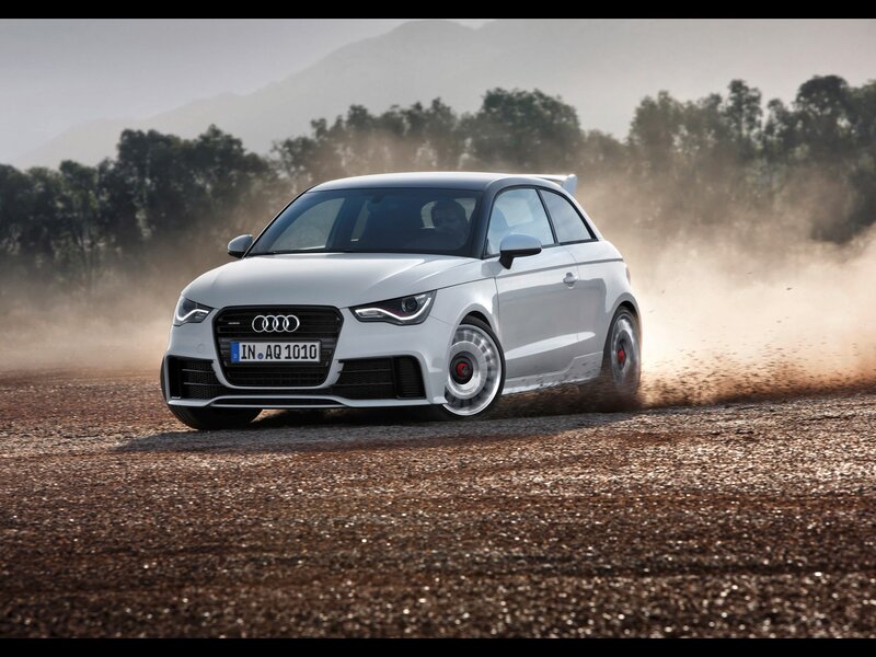 White Audi A1 driving on dirt
