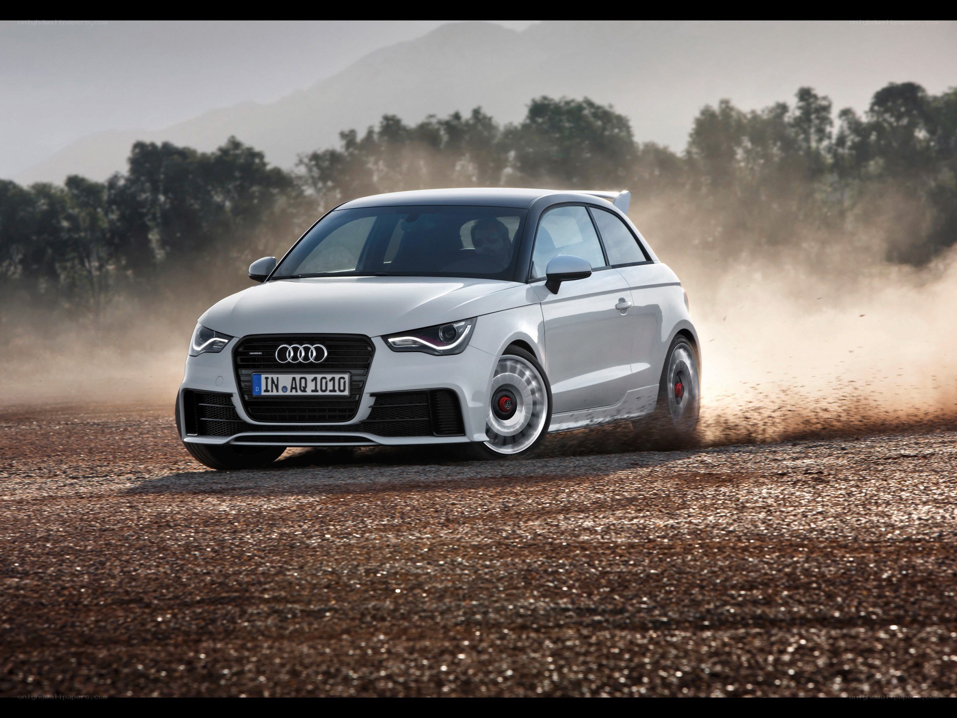 White Audi A1 driving on dirt