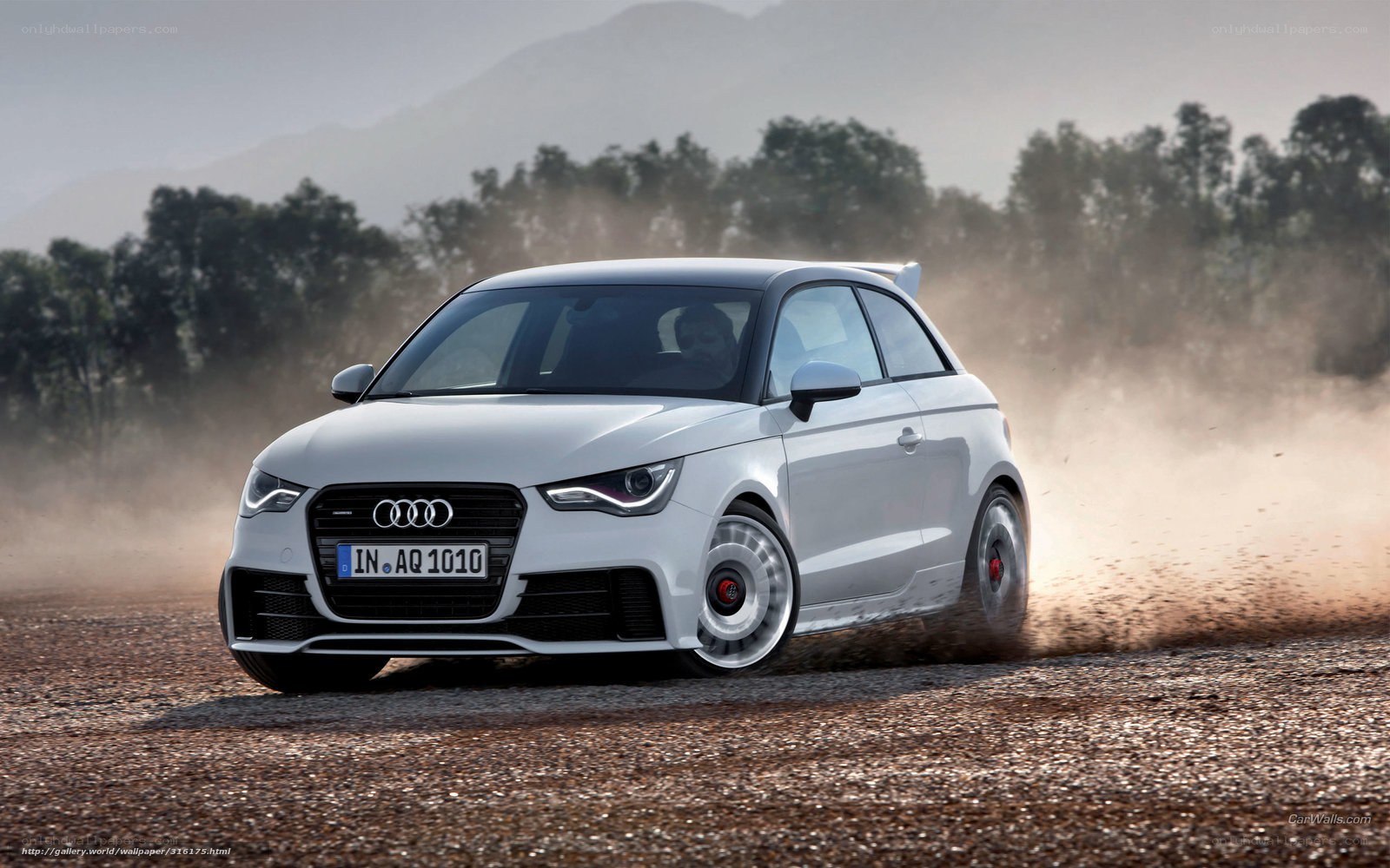 White Audi A1 driving on dirt