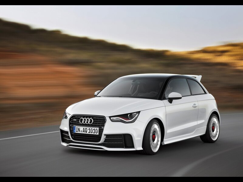 White Audi A1 driving on road