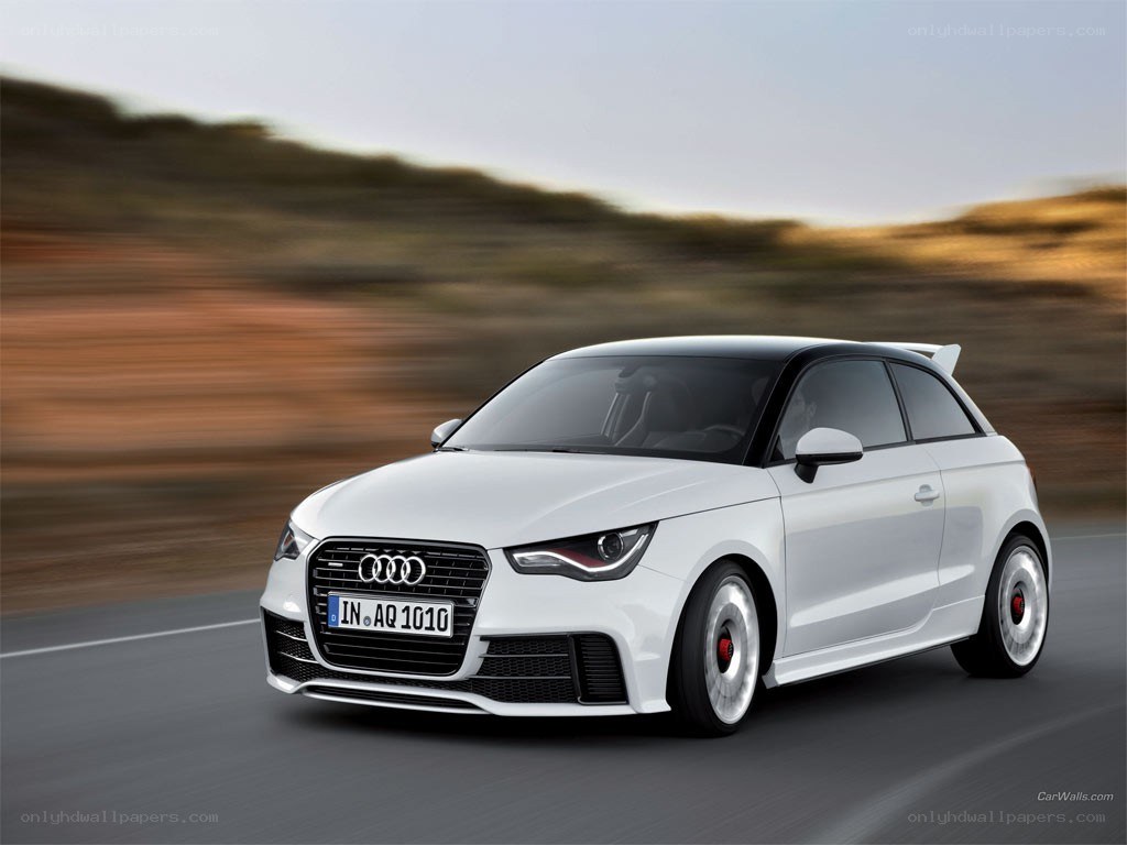 White Audi A1 driving on road