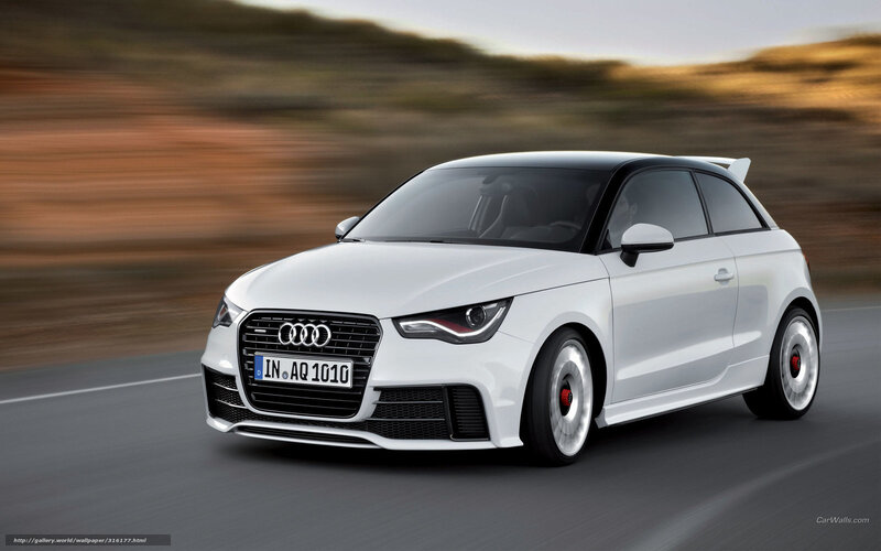 White Audi A1 driving on road
