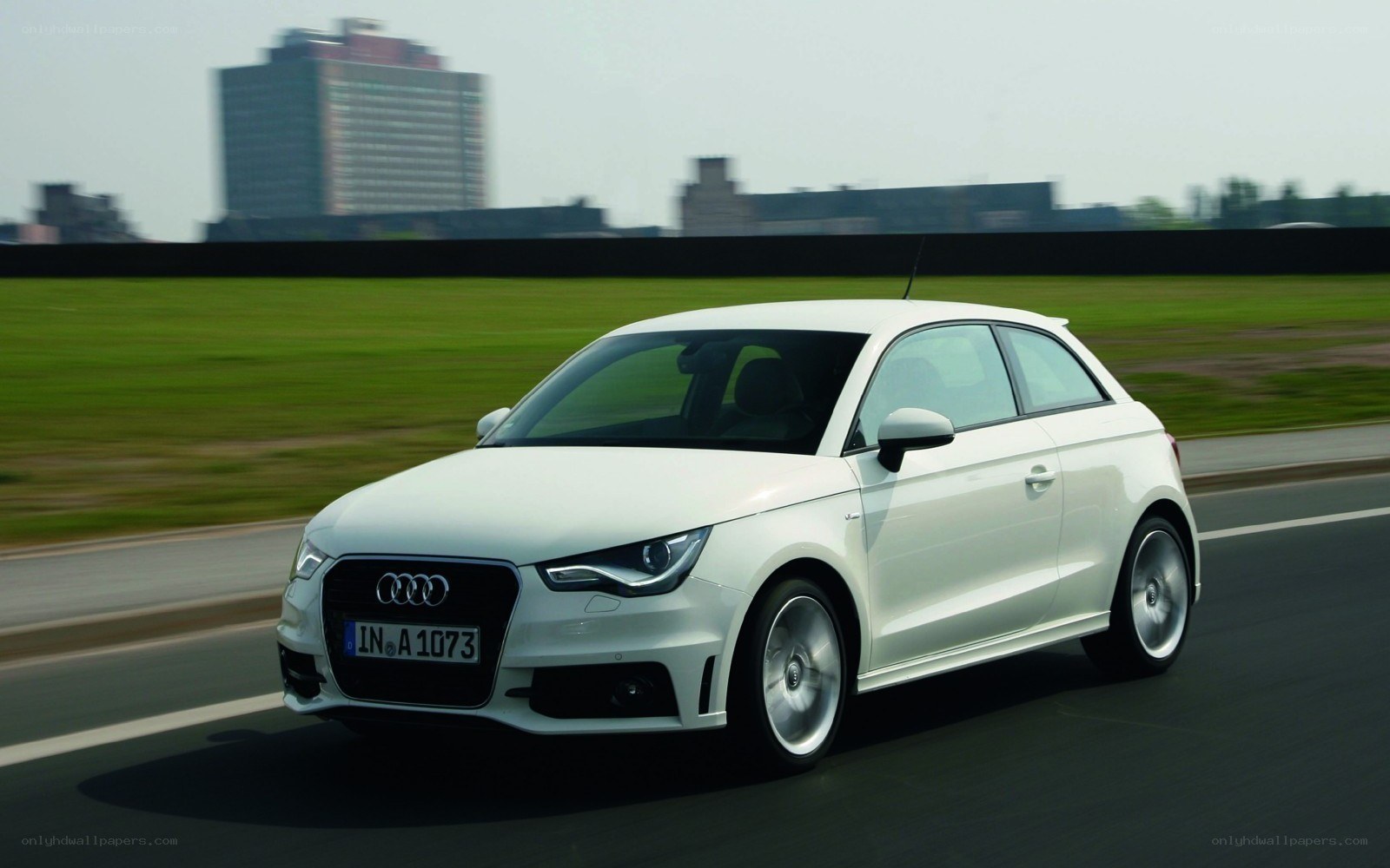 White Audi A1 in motion