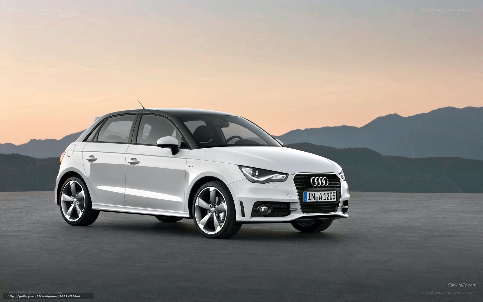 White Audi A1 on a mountain road