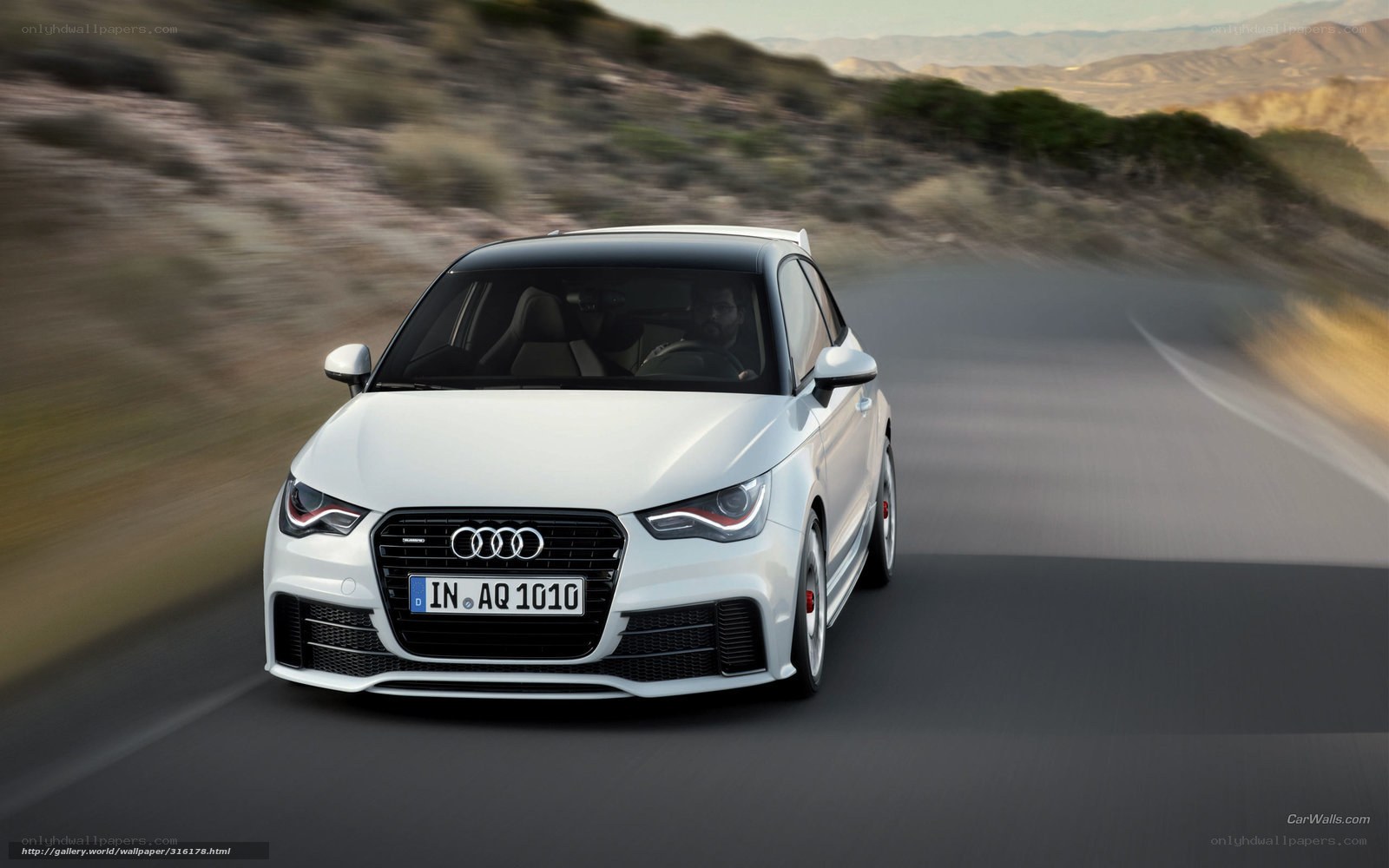 White Audi A1 on a winding road