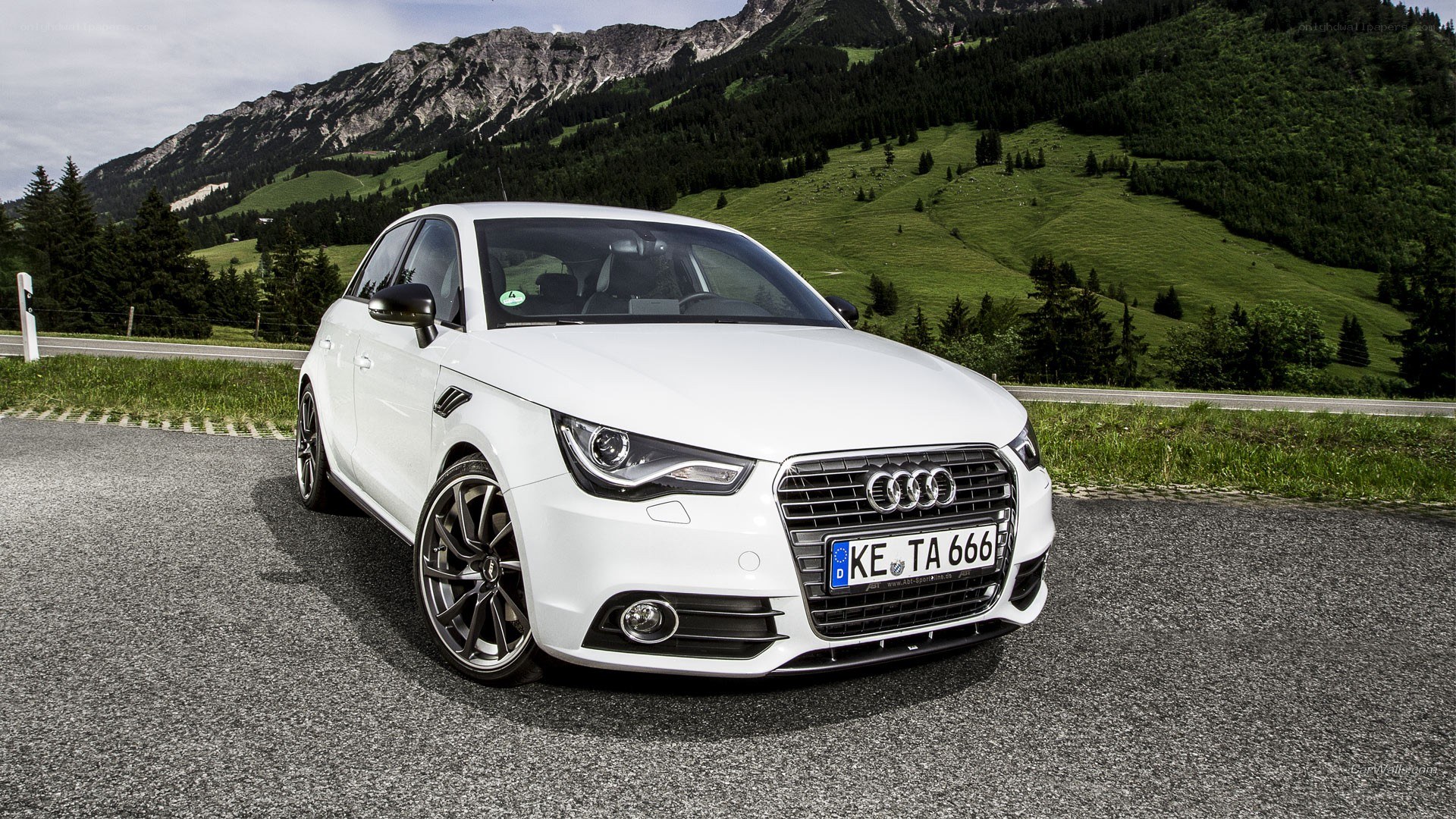 White Audi A1 on mountain road