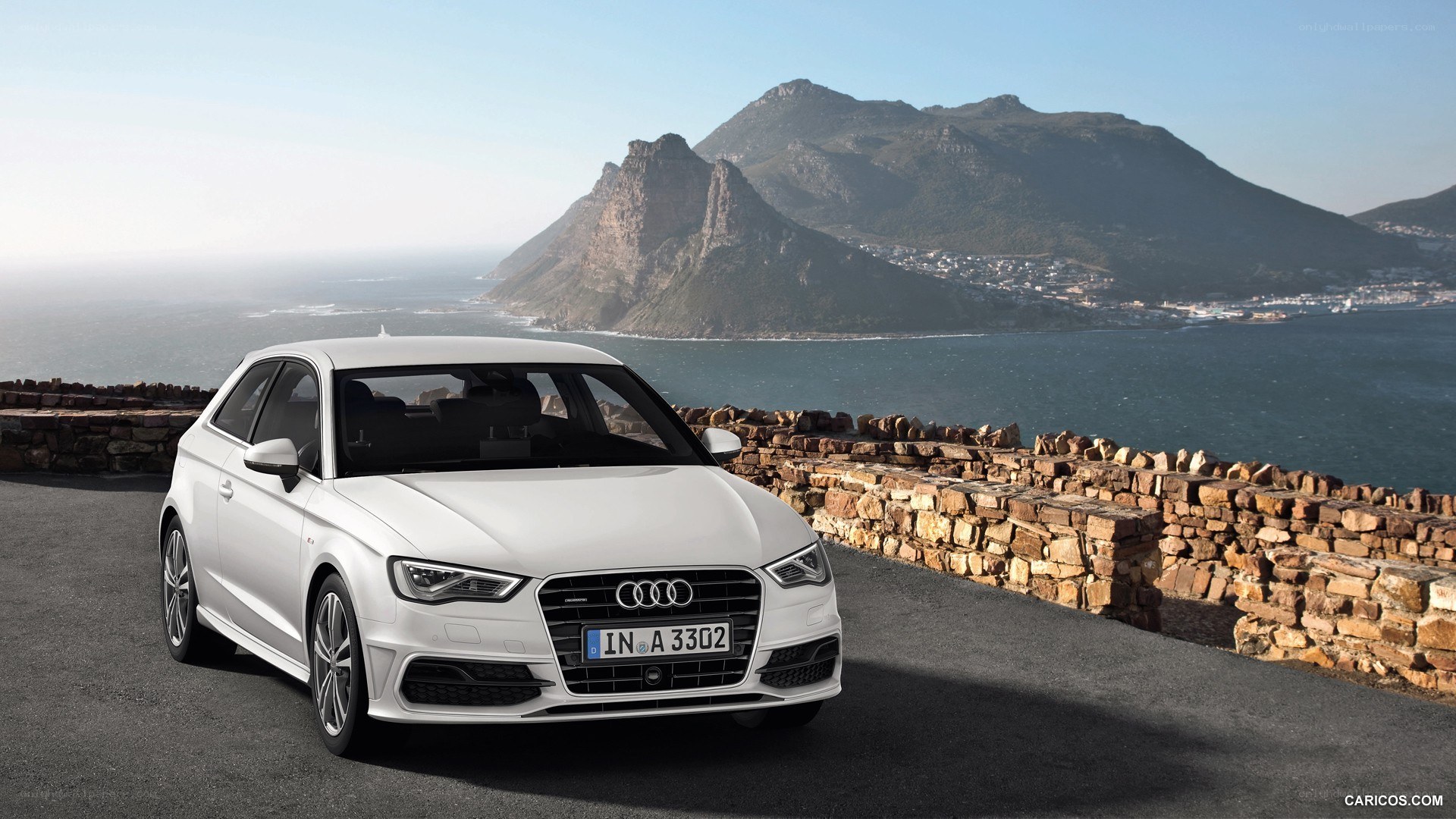 White Audi A3 by the coast