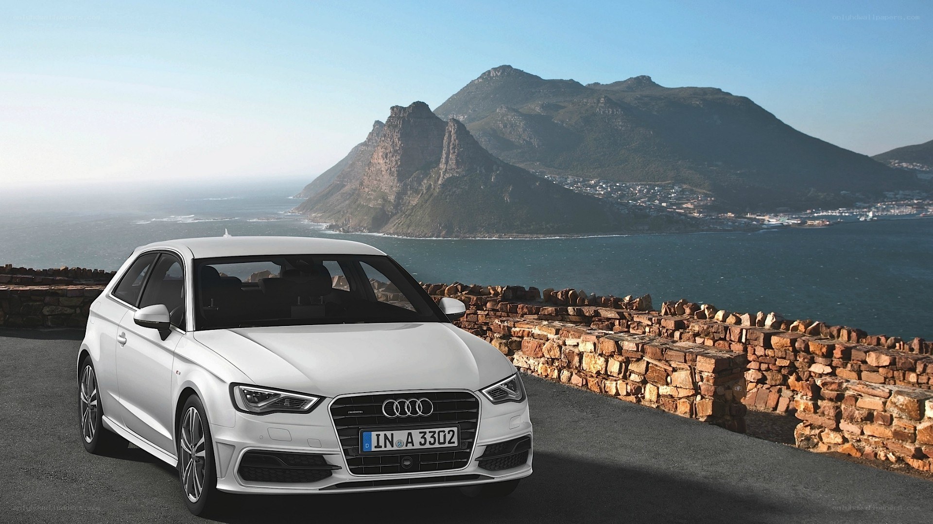 White Audi A3 by the coast