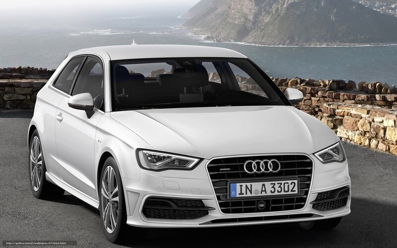 White Audi A3 parked by the sea
