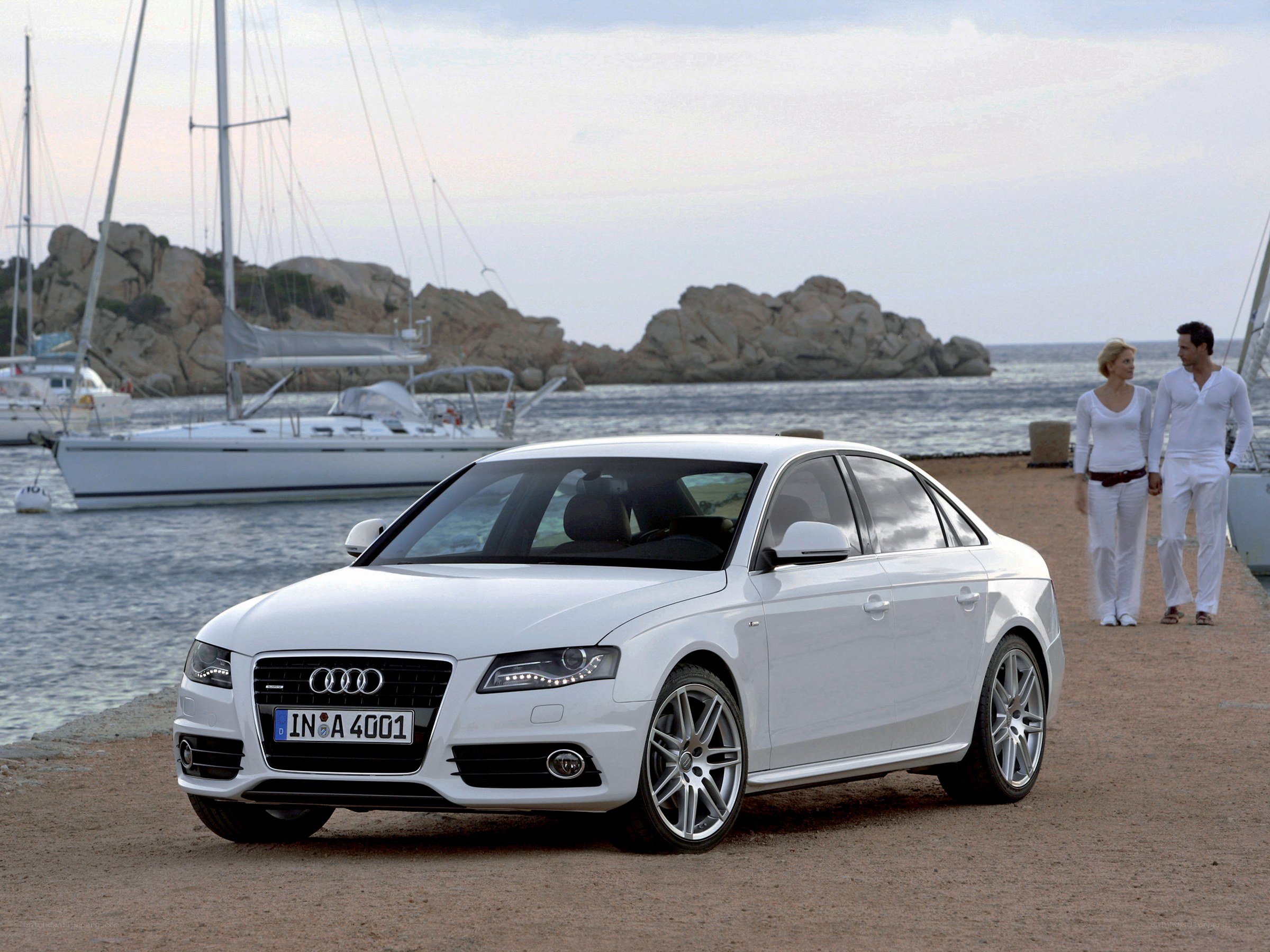 White Audi A4 by the sea