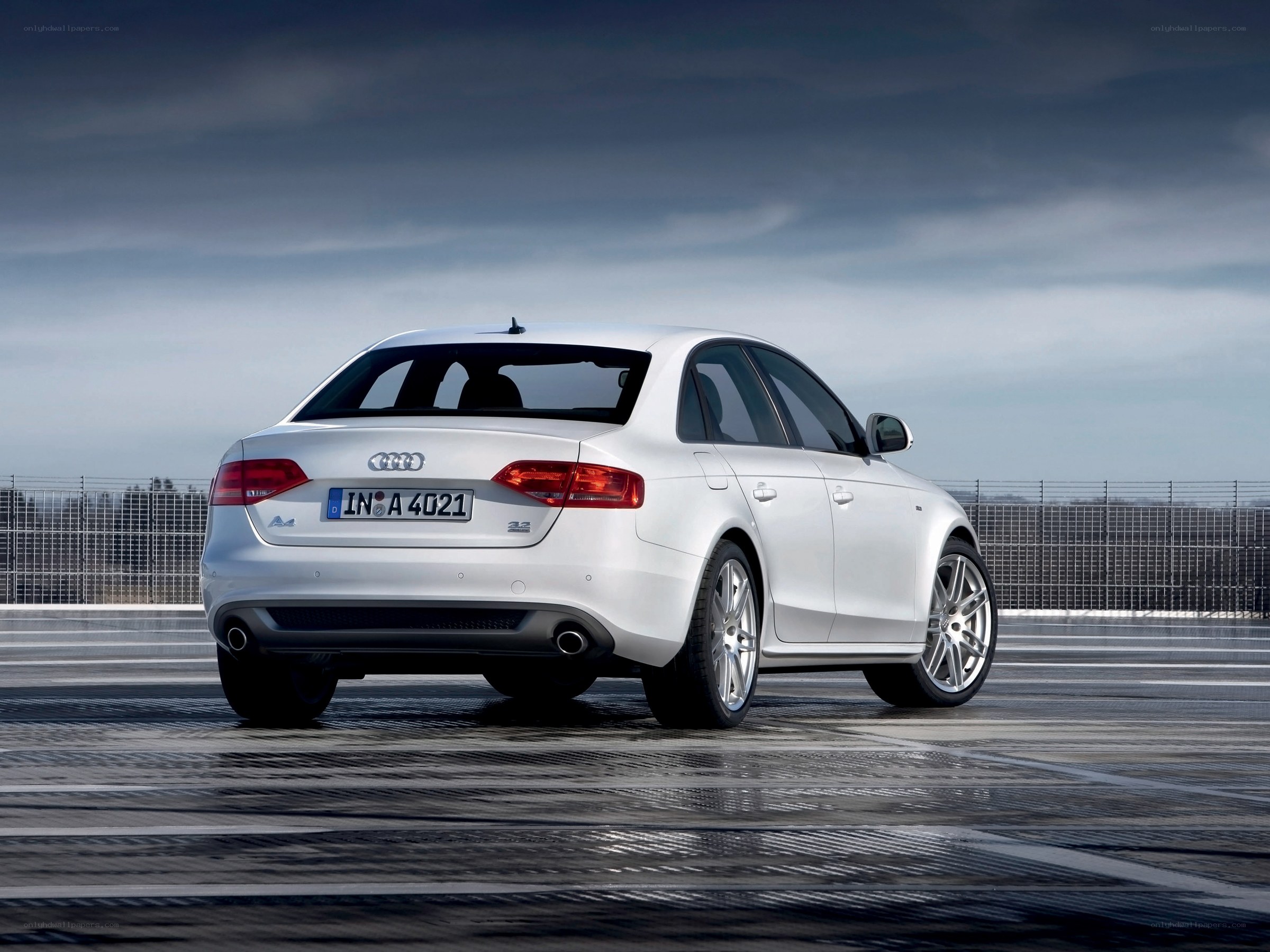 white audi a4 on racetrack