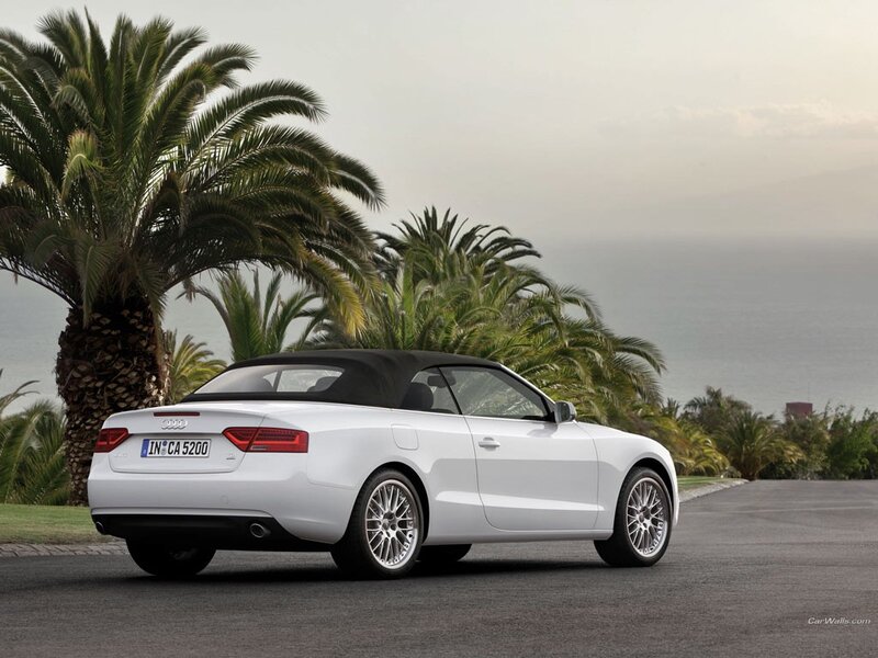White Audi A5 Cabriolet by the sea