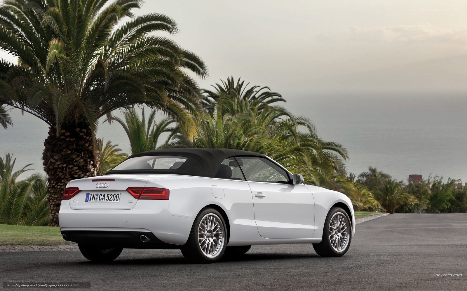 White Audi A5 Cabriolet by the sea