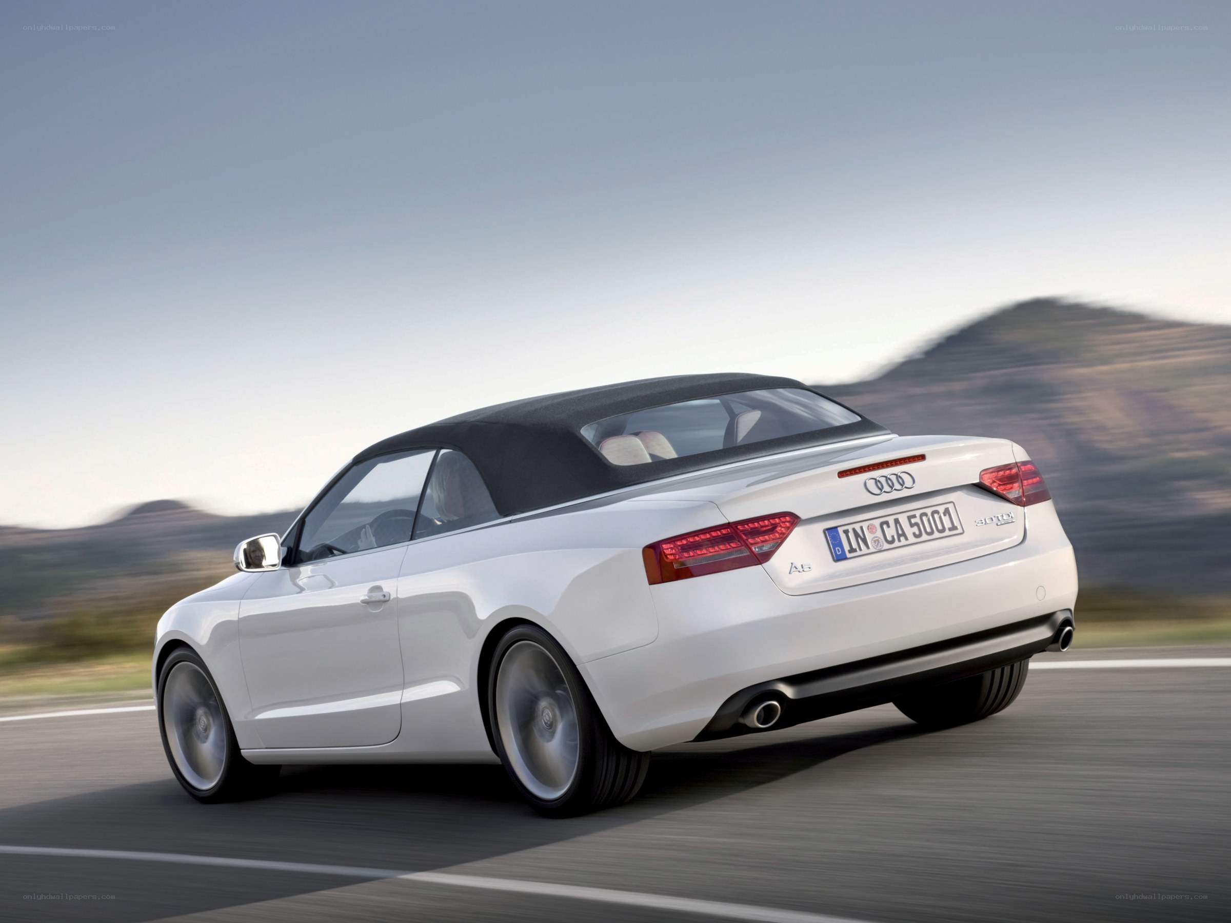 white audi a5 cabriolet in motion