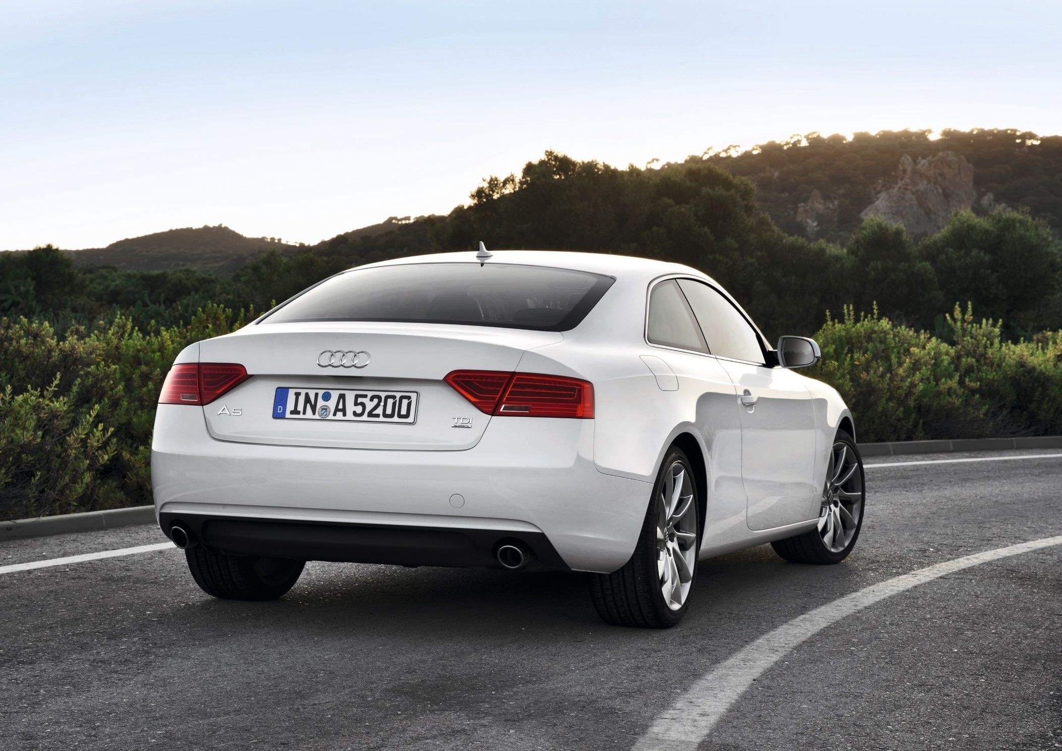 White Audi A5 on a winding road