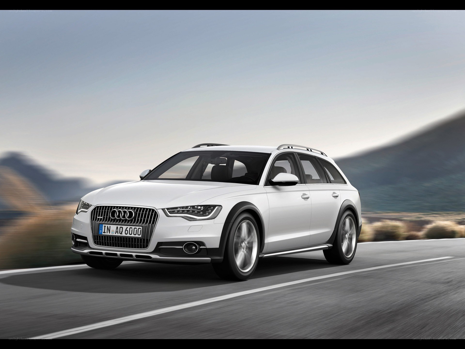 White Audi A6 Allroad in motion