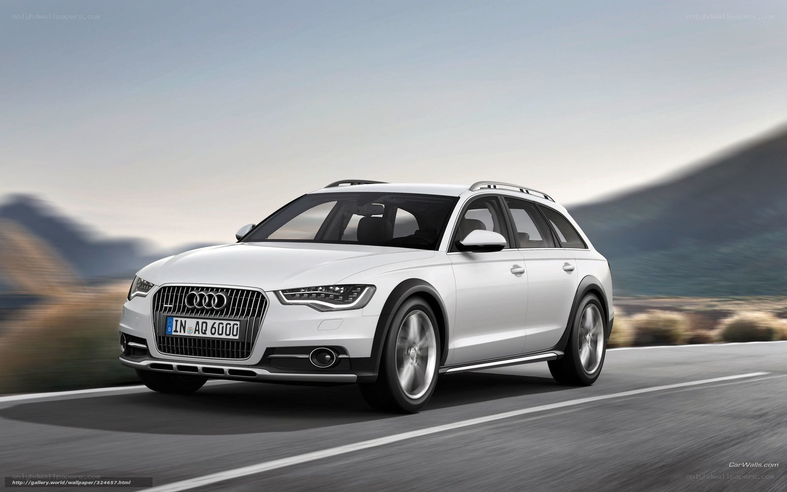 White Audi A6 Allroad in motion