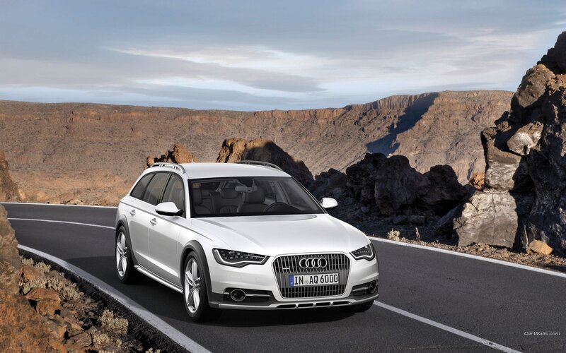 White Audi A6 Allroad on mountain road