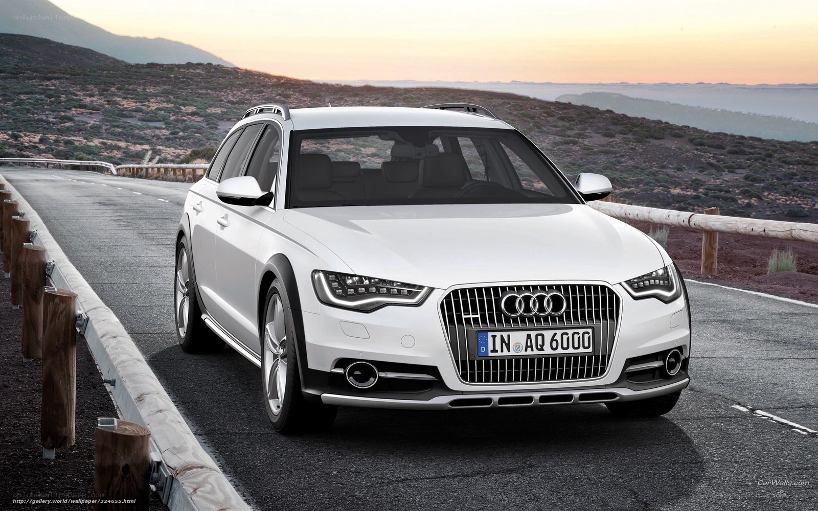 White Audi A6 Allroad on mountain road