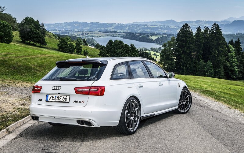 White Audi A6 Avant on a scenic road
