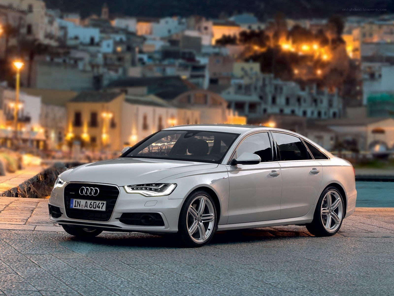 White Audi A6 by the waterfront