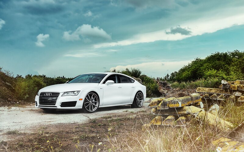 White Audi A7 on a gravel path