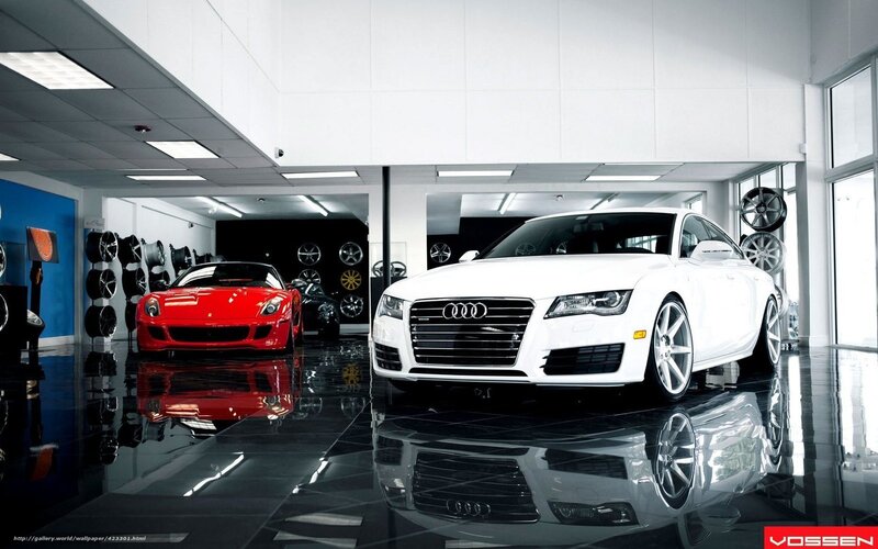 White Audi and Red Ferrari in showroom