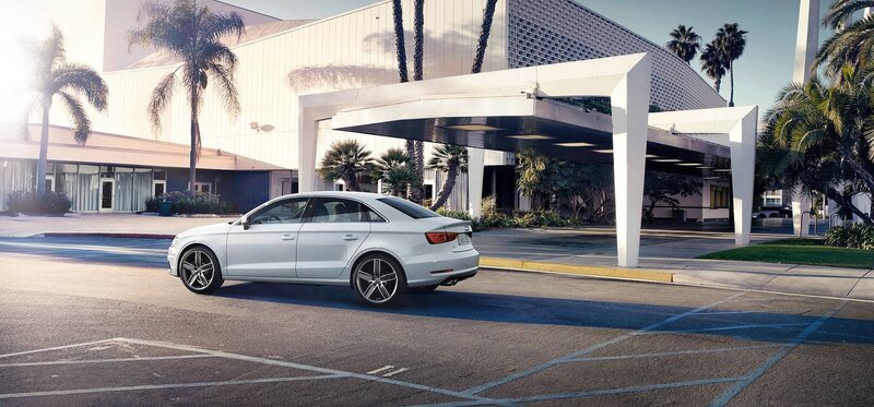 White Audi at hotel entrance