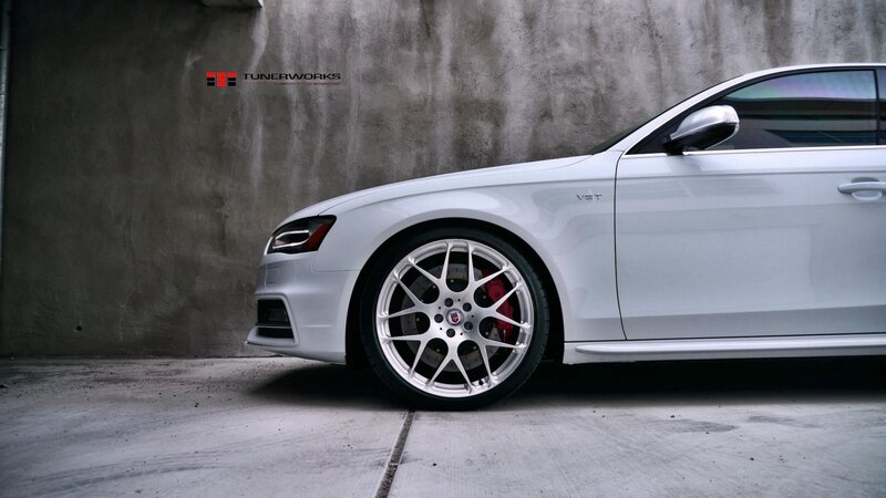 White Audi Car — Dramatic, Photograph, Car Wheel, Concrete Wall