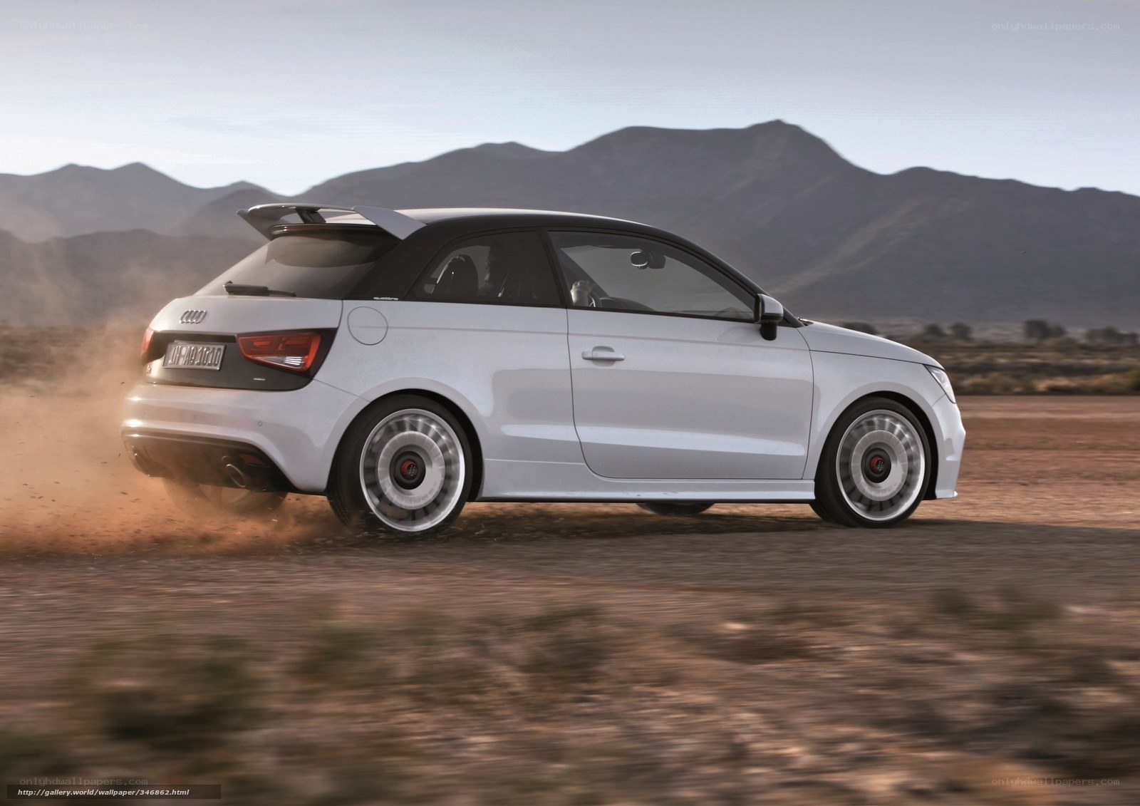 white audi car on dirt road