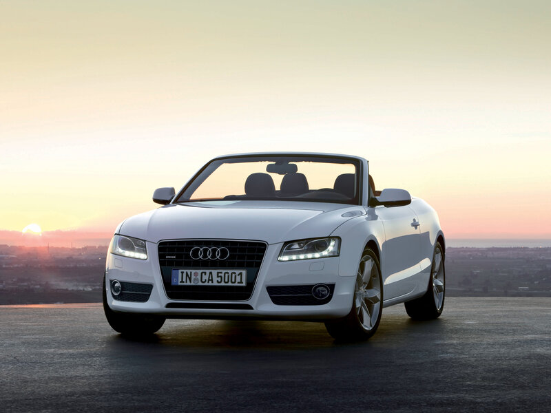White Audi convertible at sunset